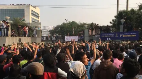 Students outside the auditorium