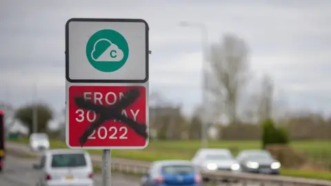 Getty Images defaced sign about the Clean Air Zone