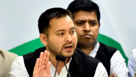 Getty Images Tejashwi Yadav at a press conference