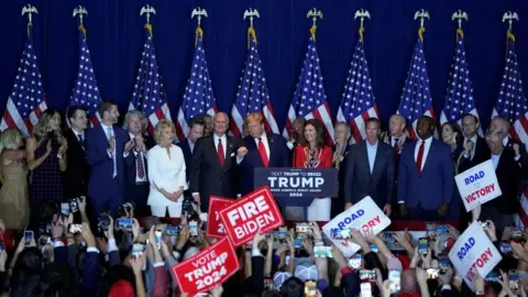 Getty Images Nearly two dozen allies flanked Mr Trump during his victory speech after the South Carolina primary