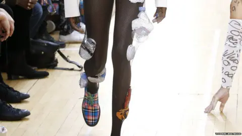 Vivienne Westwood Plastic bottles and cans were trapped in tights as part of Westwood's environmental message