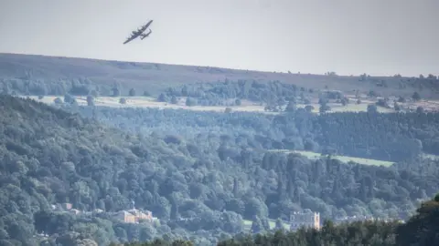 Lancaster Bomber flying over Chatsworth House, in Derbyshire