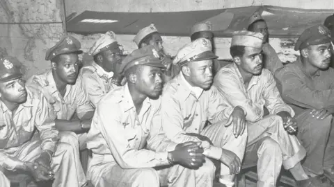 Getty Images World War II pilots being briefed to fly a mission over Italy