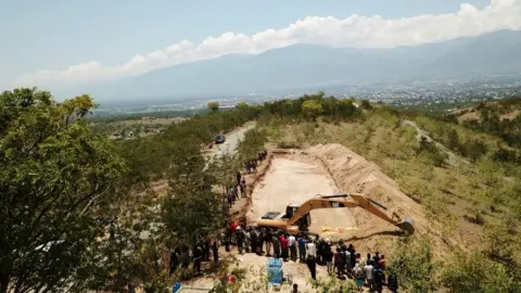 Reuters A view of a mass grave for victims of the earthquake and tsunami in Palu, Central Sulawesi,