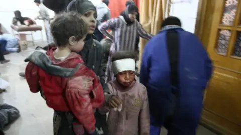 AFP Wounded Syrians seek treatment at a makeshift hospital in Kafr Batna, in the besieged rebel-held Eastern Ghouta, following reported Syrian government air strikes (21 February 2018)