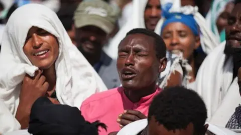 AFP People mourn the death of Dinka Chala who was shot dead by the Ethiopian forces the day earlier