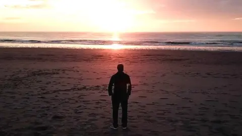 Migrant on beach