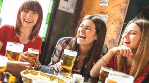 Getty Images Women in a pub