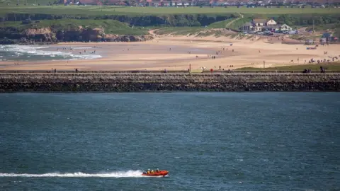 RNLI Tynemouth RNLI inshore lifeboat speeds to South Shields ferry landing with two casualties on board