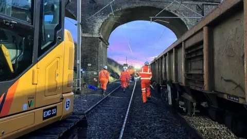Network Rail engineers clearing landslide