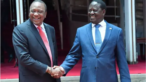 AFP Kenyatta and Odinga shaking hands