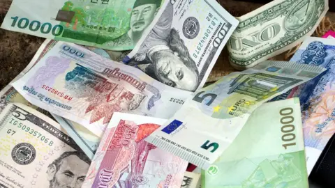 Getty Images US dollars, Korean Won, Euro bills and some money bills and b