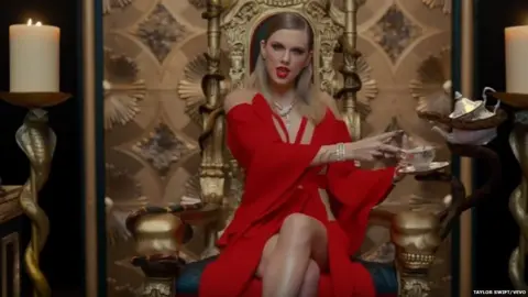 Taylor Swift/Vevo Taylor Swift on a throne