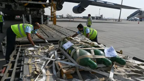 Getty Images Oxygen ventilators are unpacked in Delhi