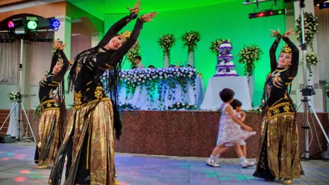 Hermes Images/AGF/Getty Images Dancers at Uzbek wedding, Samarkand