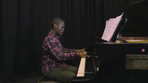 Michael Fuller performing at the piano