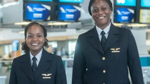 First Officer Refilwe Moreetsi and Captain Annabel Vundla at a media briefing of the first black African female flight deck crew at Cape Town International Airport on October 25, 2022