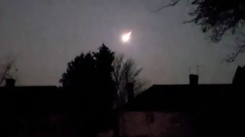 Asteroid above houses