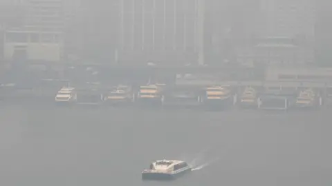 Getty Images Sydney harbour ferries in the dock amid thick smoke