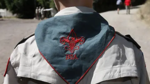 Getty Images A Boy Scout listens to instructions at camp in Utah on 31 July 2015.