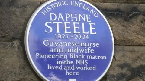 PA Media The blue plaque to Daphne Steele