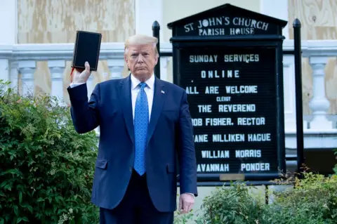 Getty Images Trump holds Bible outside church