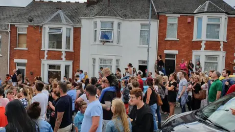 Nicola Martin A crowd of people in the street where Gavin and Stacey is filmed