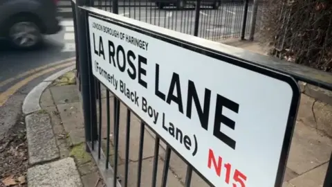 David Faye New street sign which reads La Rose Lane (Formerly Black Boy Lane)