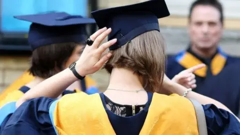 PA Student adjusting her hat