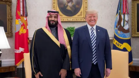 ANDAR ALGALOUD / SAUDI KINGDOM COUNCIL / HANDOUT President Donald Trump poses for a photo with Crown Prince Mohammed bin Salman Al Saud in Oval Office