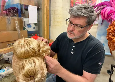 BBC David Robbins working on a wig