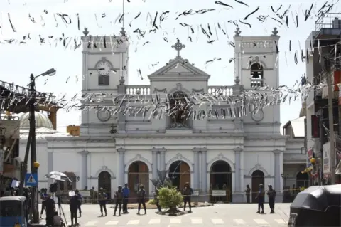 EPA White bunting being in front of St Anthony's Church as the city prepares for the funerals of the blast victims in Kochchikade, Colombo, Sri Lanka, 22 April 2019.