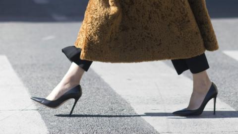 Fine firms for sexist dress rules, say MPs - BBC News