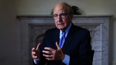 PA Media George Mitchell