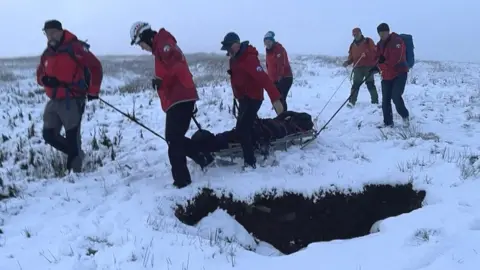 Cave Rescue Organisation A casualty is transported to an ambulance