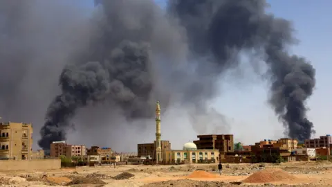 Reuters Khartoum up in smoke during clashes between military groups.
