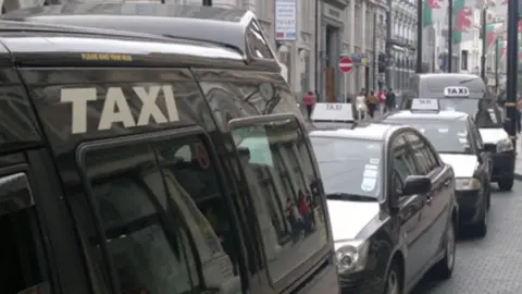 BBC Taxis queuing in rank