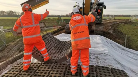Environment Agency Environment Agency building flood defences on River Aire