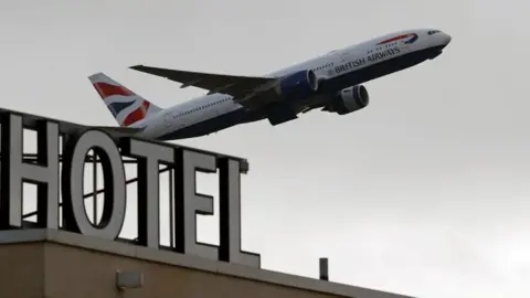 Getty Images A British Airways aircraft is pictured as it takes off from behind the Sofitel hotel at Terminal 5 of London Heathrow Airport