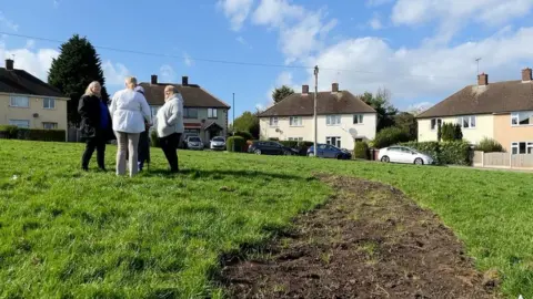 Residents standing in the middle of Redruth Close