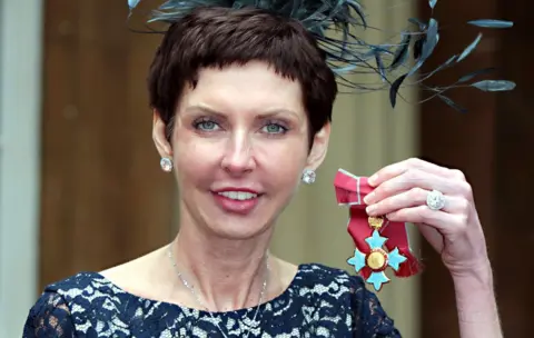 Getty Images Denise Coates collecting CBE in 2012