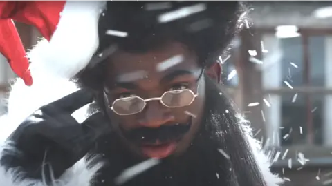 Lil Nas X / YouTube Lil Nas X in the video for Holiday