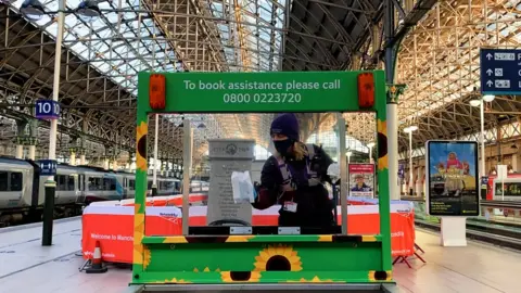 Network Rail An assistance buggy being cleaned at Manchester Piccadilly station