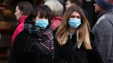 People wearing face masks in central London