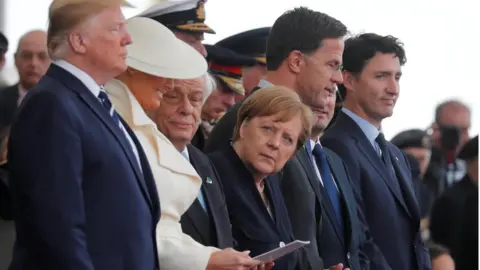 Reuters U.S. President Donald Trump, First Lady Melania, German Chancellor Angela Merkel, Dutch Prime Minister Mark Rutte and Canada's Prime Minister Justin Trudeau