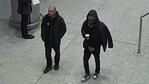 Met Police CCTV image of two men the Met is trying to identify