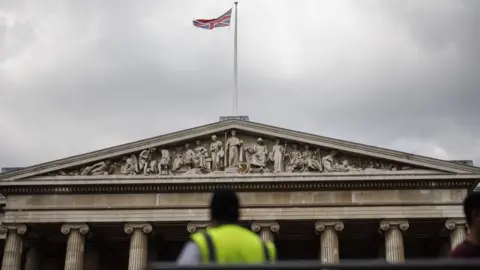 EPA-EFE/REX/Shutterstock A Union Jack waves on top the British Museum as a security staff manages the flow of visitors in London