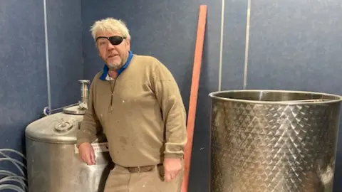 BBC Paul Kenyon in his distillery