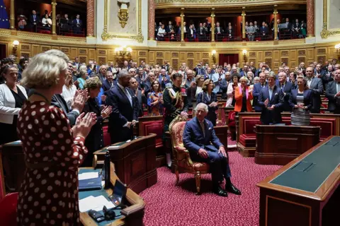 Reuters French Senators and members of the National Assembly greet King Charles at the French Senate in Paris