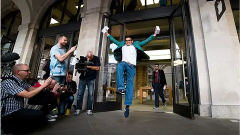 Getty Images Jamael Ahmed, the first to purchase the iPhone 6 at Apple Covent Garden's launch event in 2014